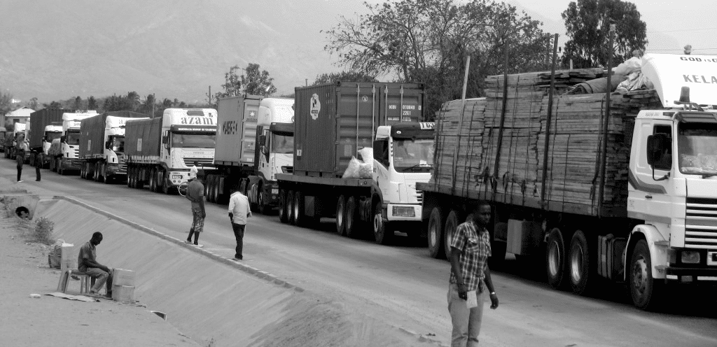 Heavy traffic of trucks waiting for their cargo to be weighed at a checkpoint in Tanzania