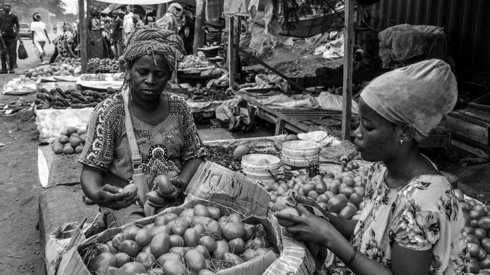 Vendors selling various food crops in one of Tanzania markets