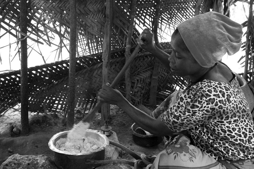 Popular meal made from cassava "Ugali" being prepared by a food vendor in Tanzania