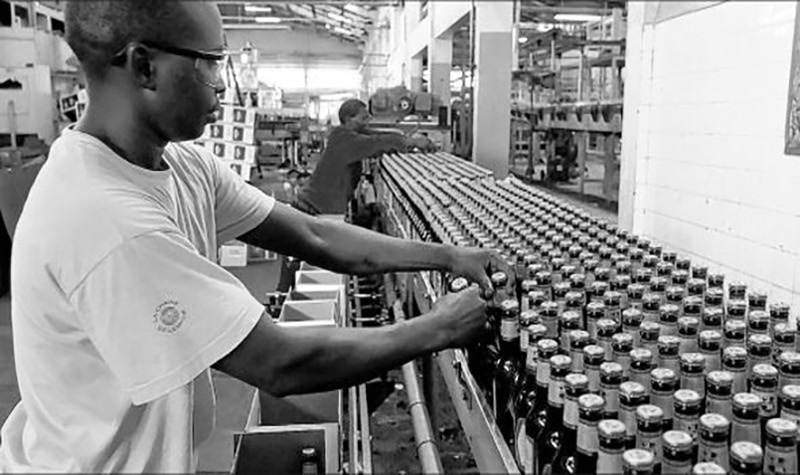Tanzania Breweries Limited (TBL) worker on the bottle assembly line
