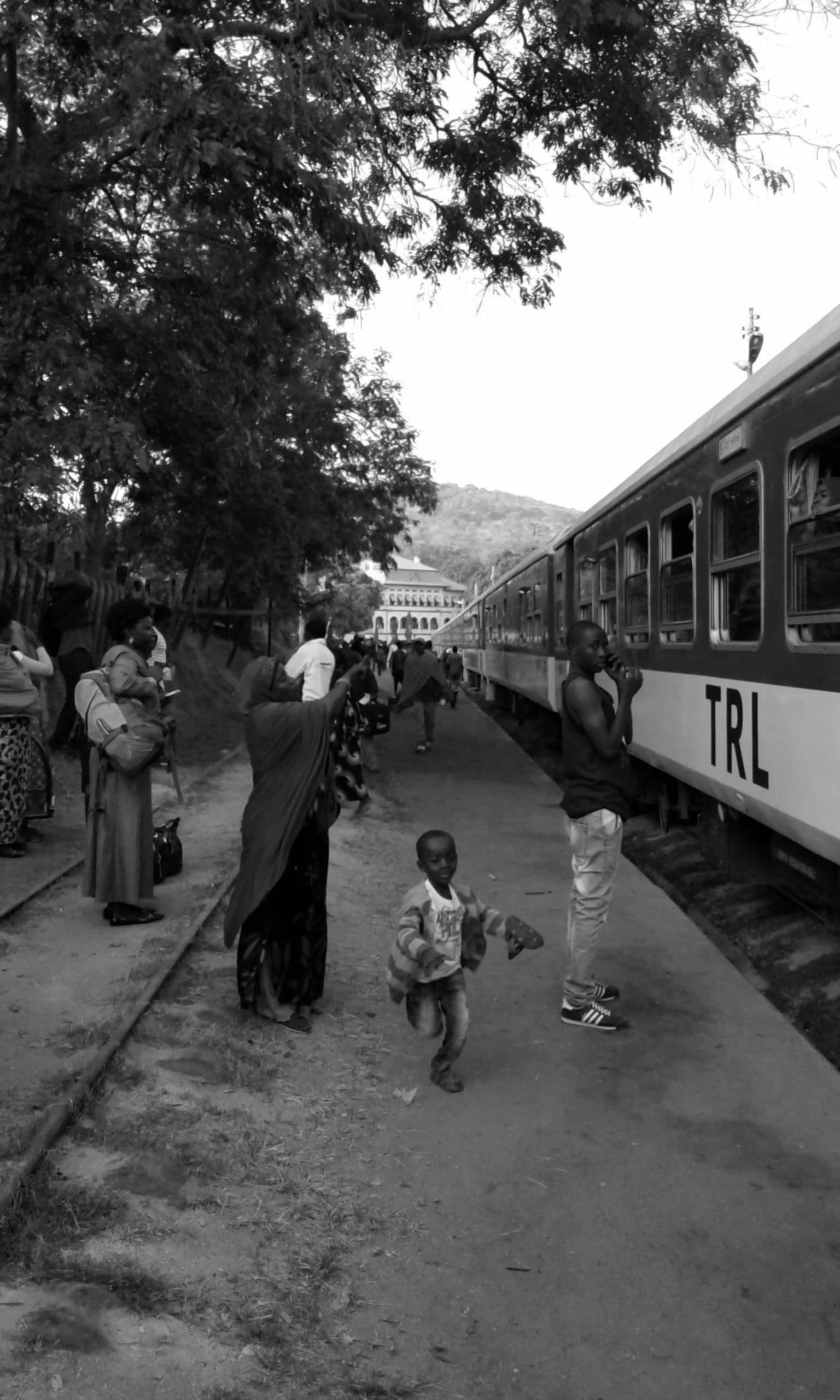 Passengers waiting to board a train at Kigoma city railway station