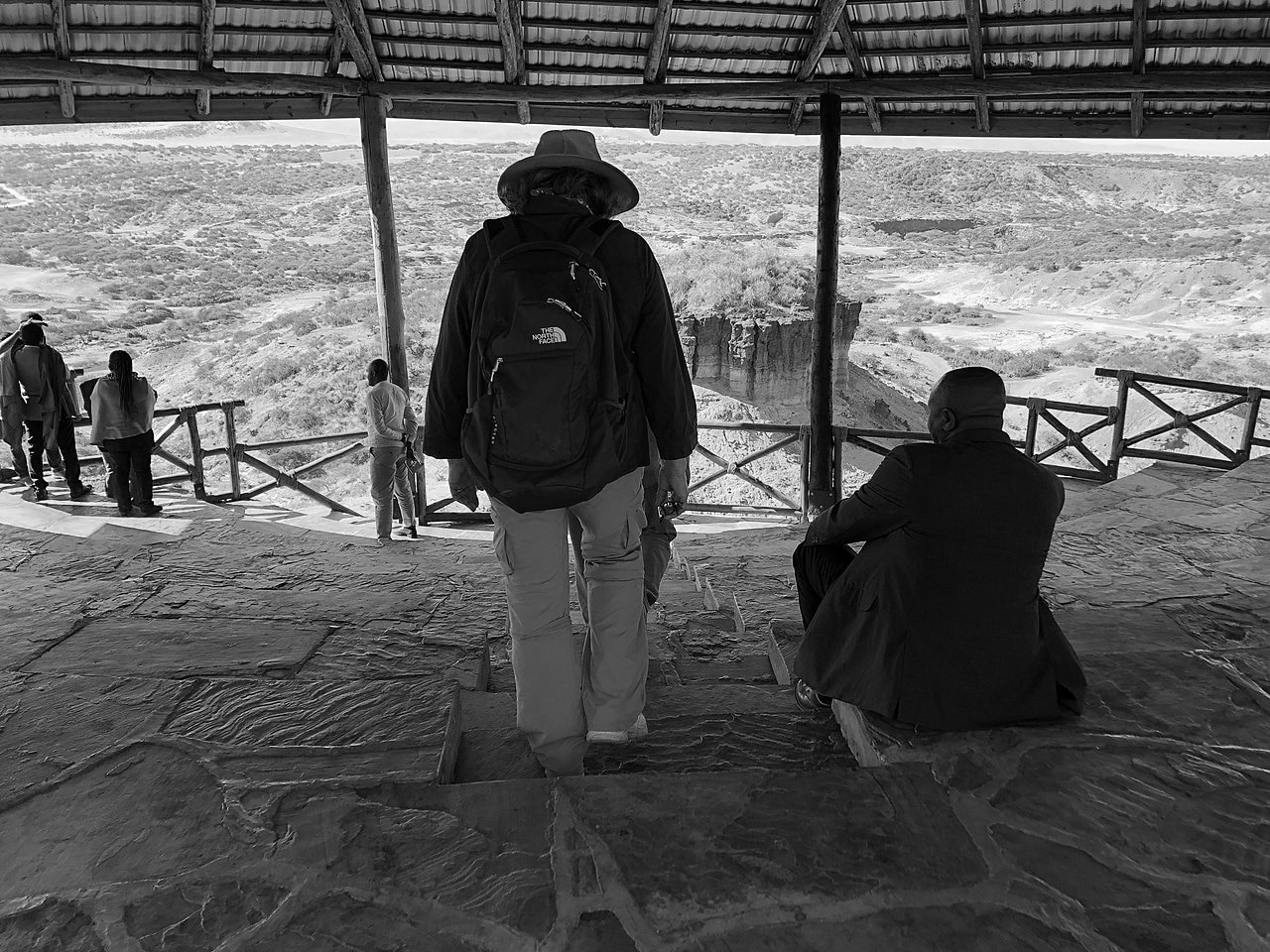 Tourists viewing the Gorge from a nice built hut at the Olduvai Gorge Museum