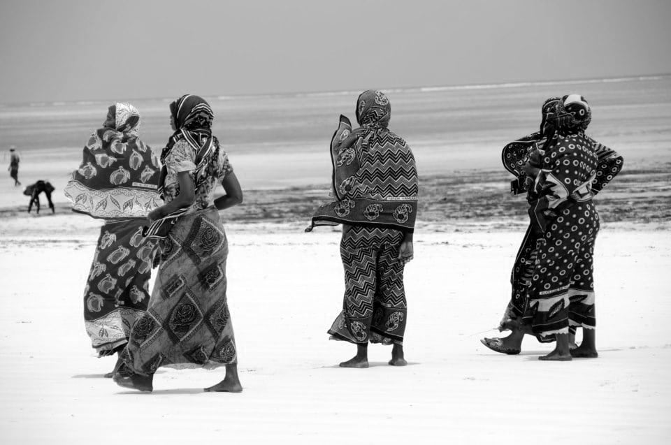 Women at the beach wearing Kanga