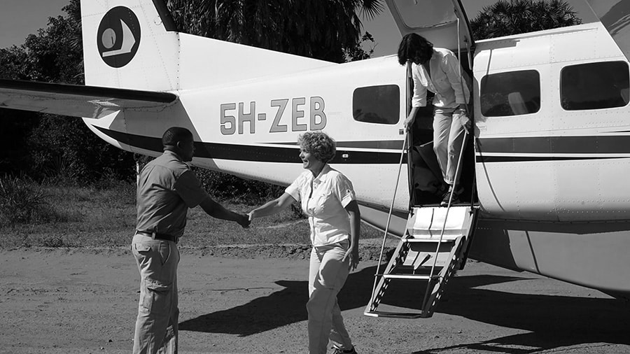 Coastal Aviation plane dropping tourists at Mtemere airstrip close to Selous River Camp