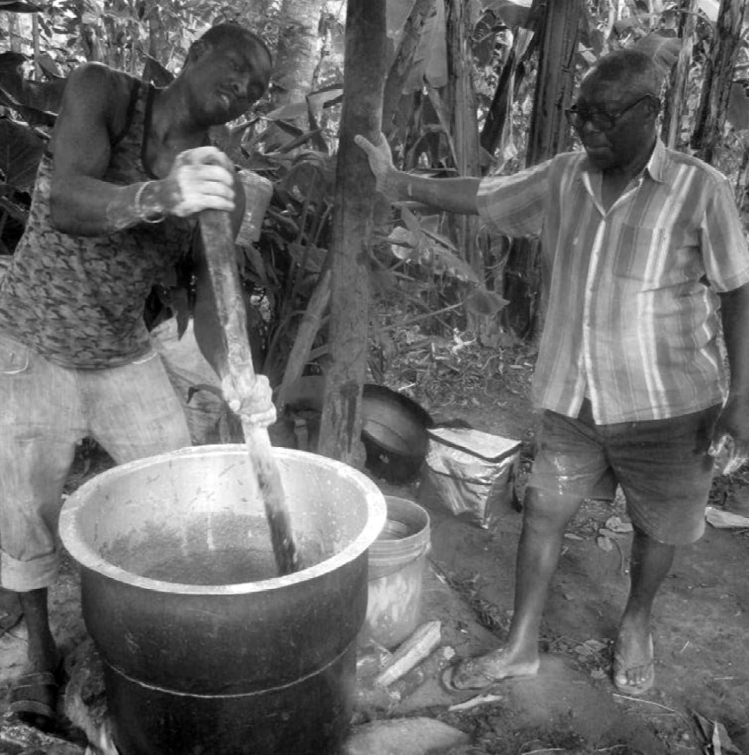 Two men brewing Mbege