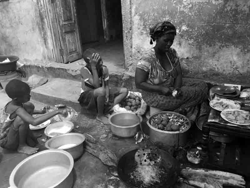 Children helping the mom to prepare food