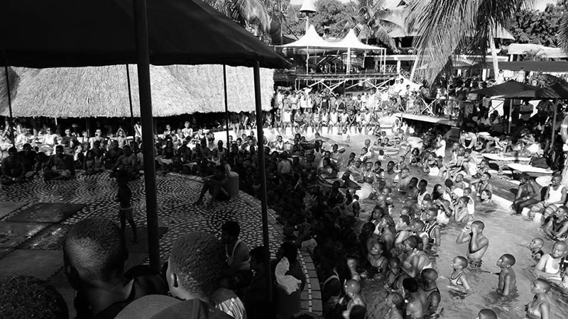 A crowd of youngsters enjoying the pool while experiencing an event - Kunduchi Wet N Wild Waterpark