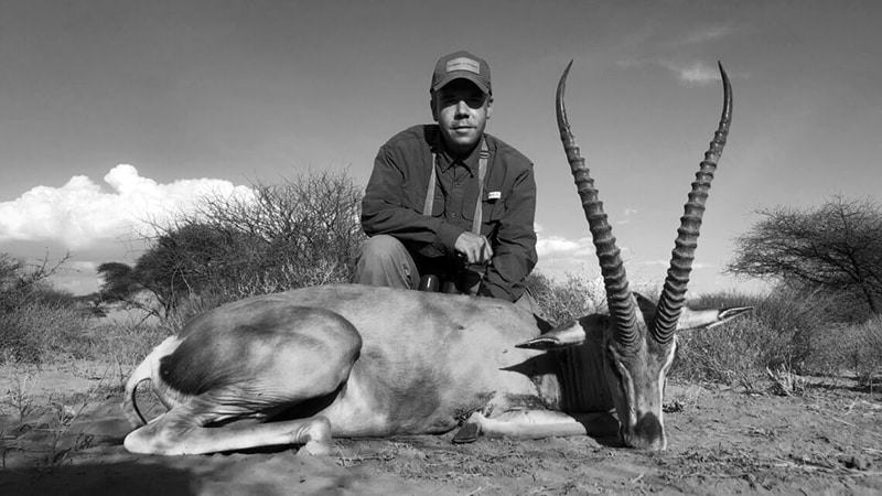 A hunter posing with a Thomson gazelle kill in Tanzania