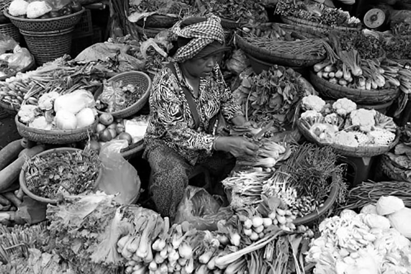 Vegetable vendor in a market in Mbeya Tanzania