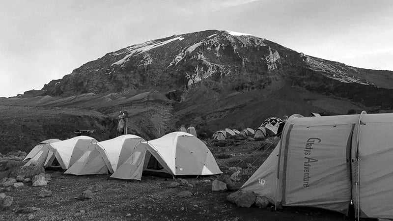A number of sleeping tents pitched on one of Kilimanjaro summits