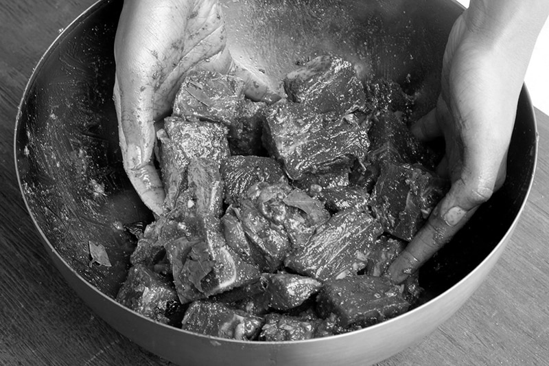 Marinating nyama choma goat meat