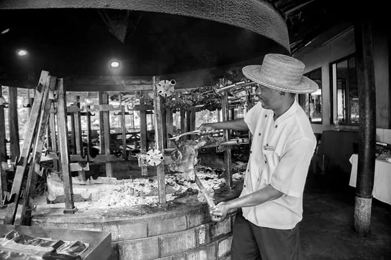 Chef barbequing chicken at the Uhuru Hostel