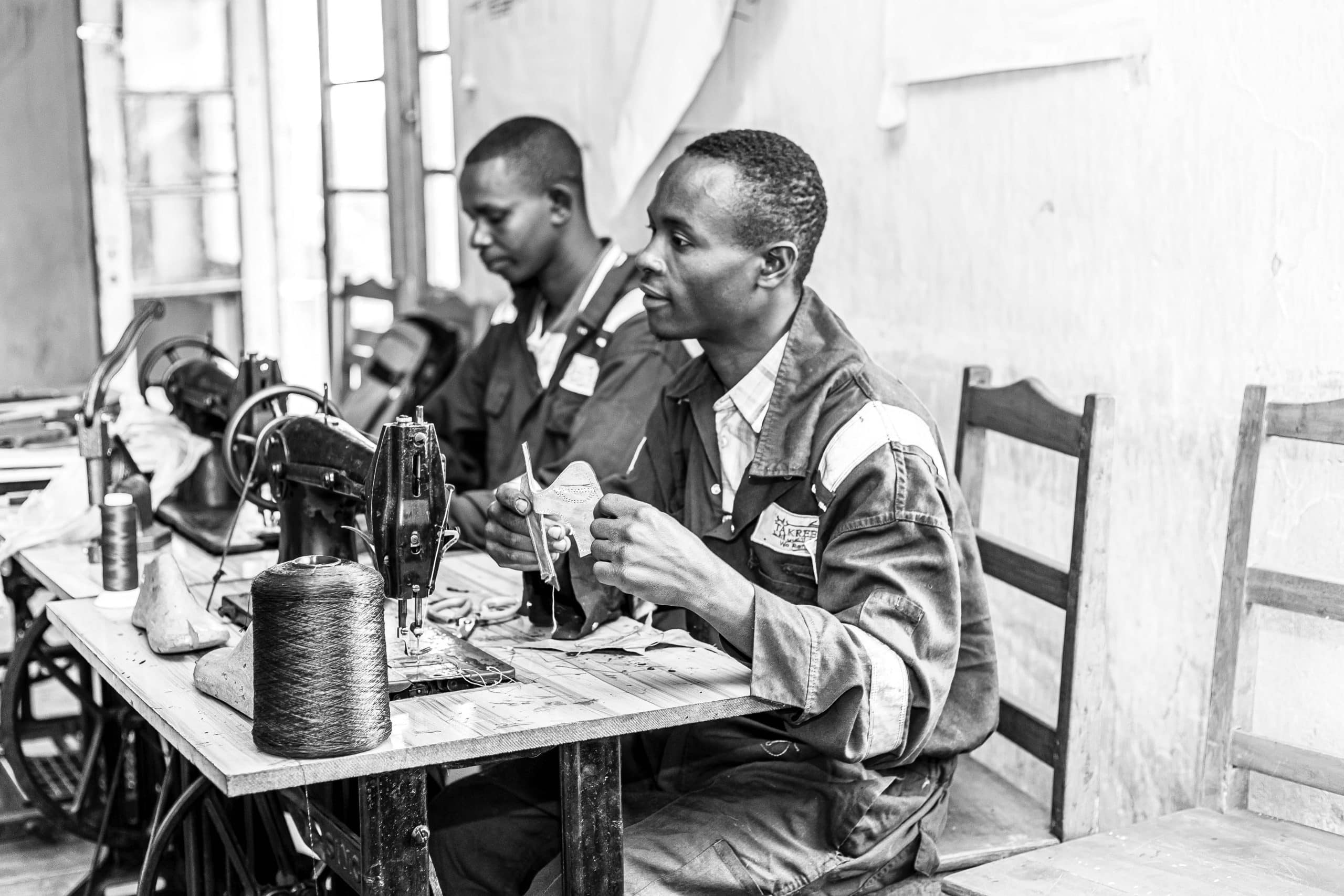 men using sewing machine to sew