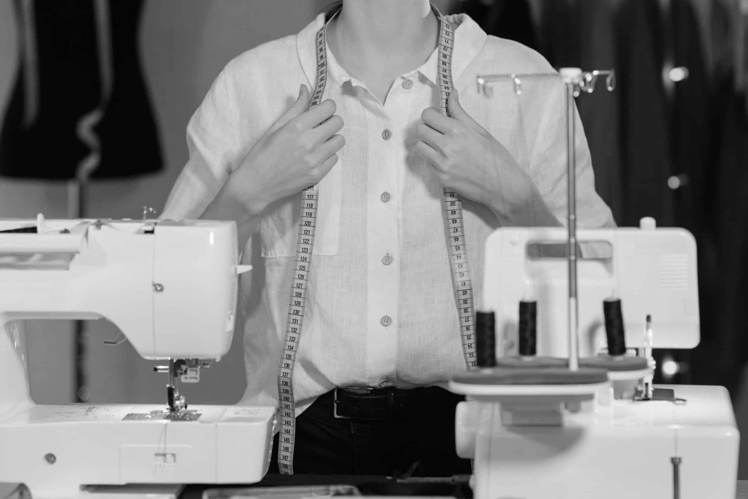tailor with hands on measuring tape