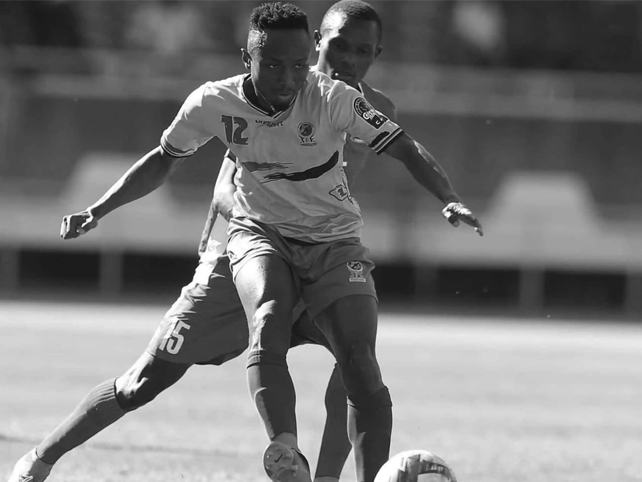 A Kenyan and a Tanzanian Football Player at a Match