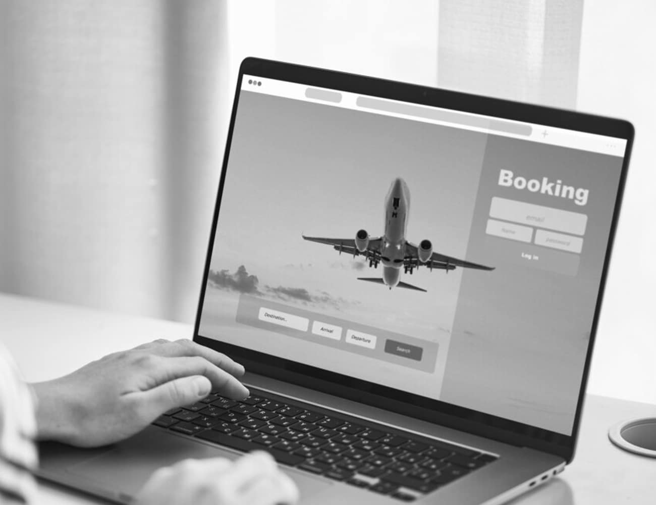 A Person Booking Flights With Laptop