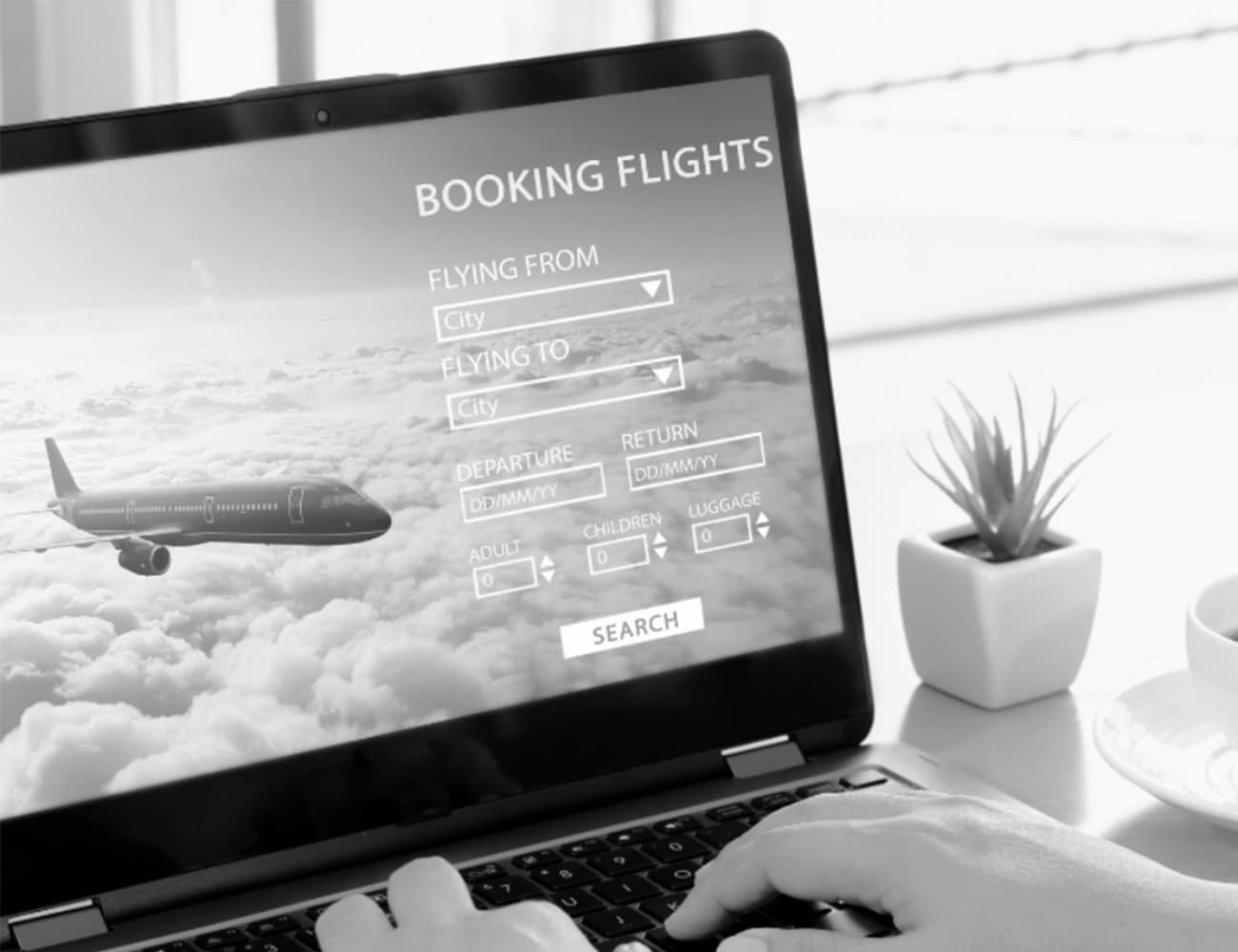 A laptop Showing a Flight Booking Website