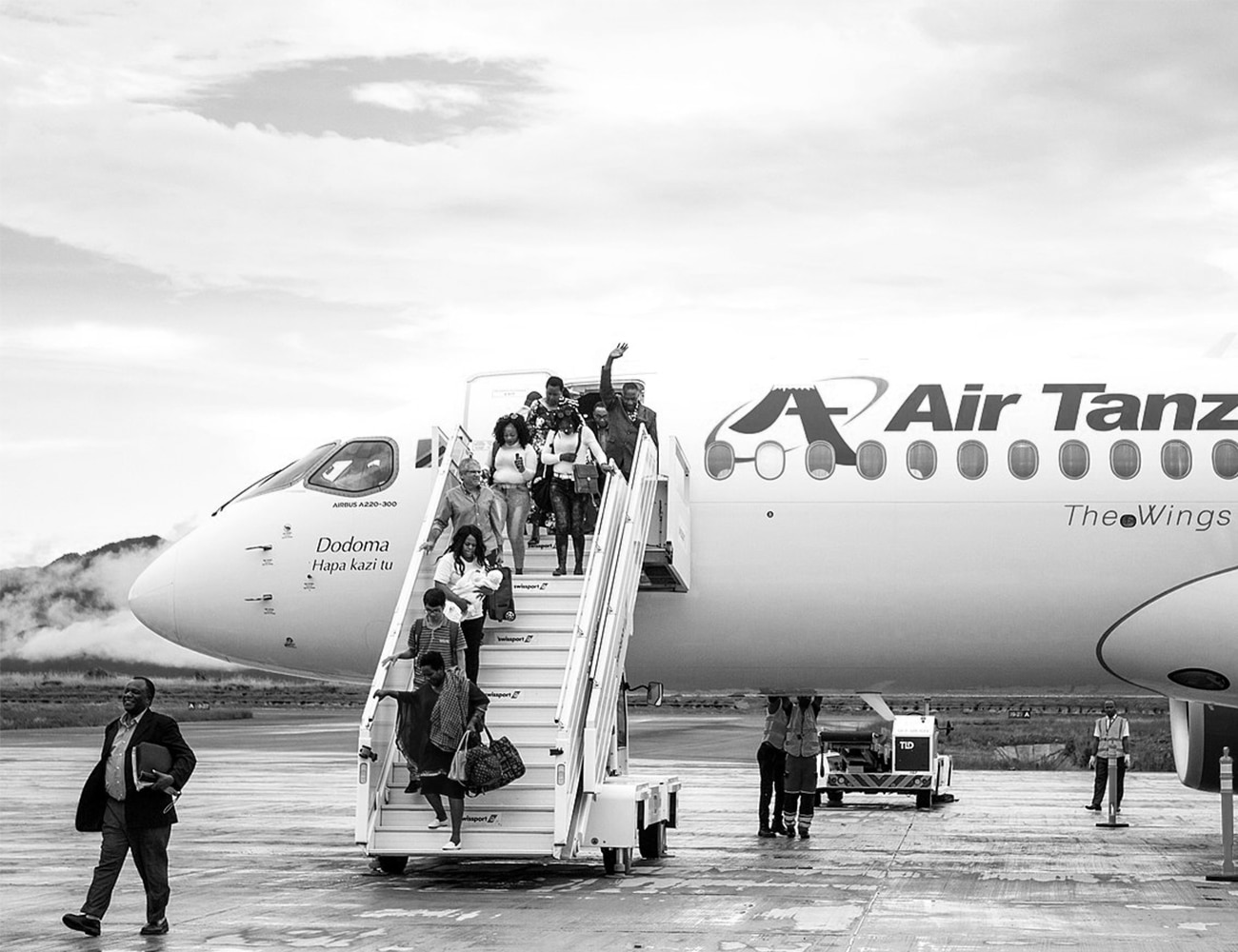Happy Air Tanzania Passengers getting off a Plane