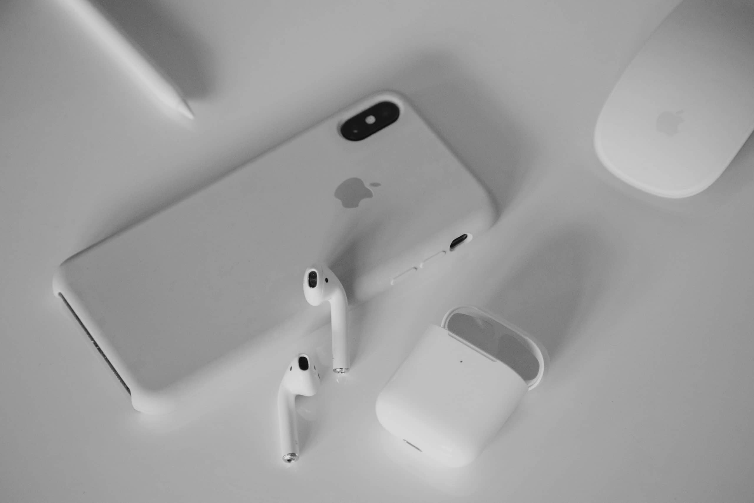 An iPhone Xs Max next to a pair of Airpods