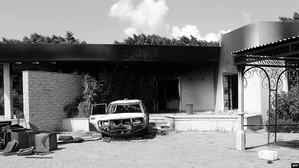Burnt house and a car inside the US embassy compound in Benghazi