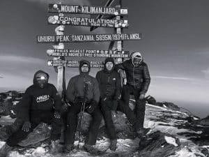 Tourist at the top of Mt Kilimanjaro