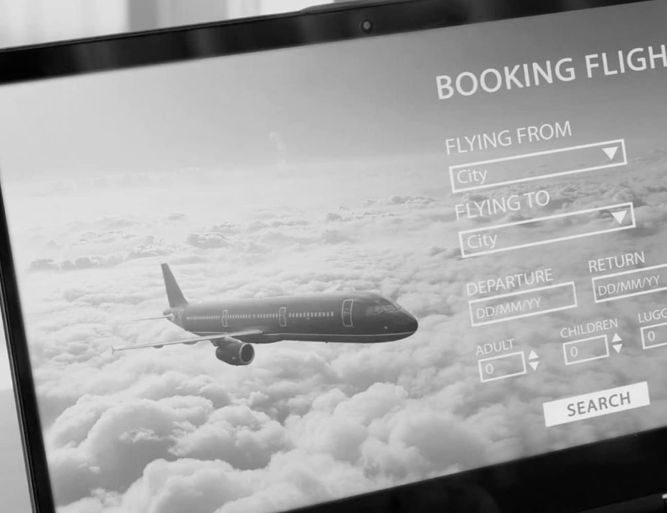 Laptop Screen Showing a Flight Booking Website