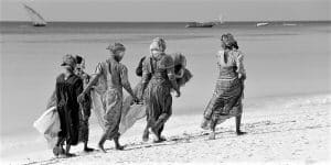Zanzibar women walking on the beach