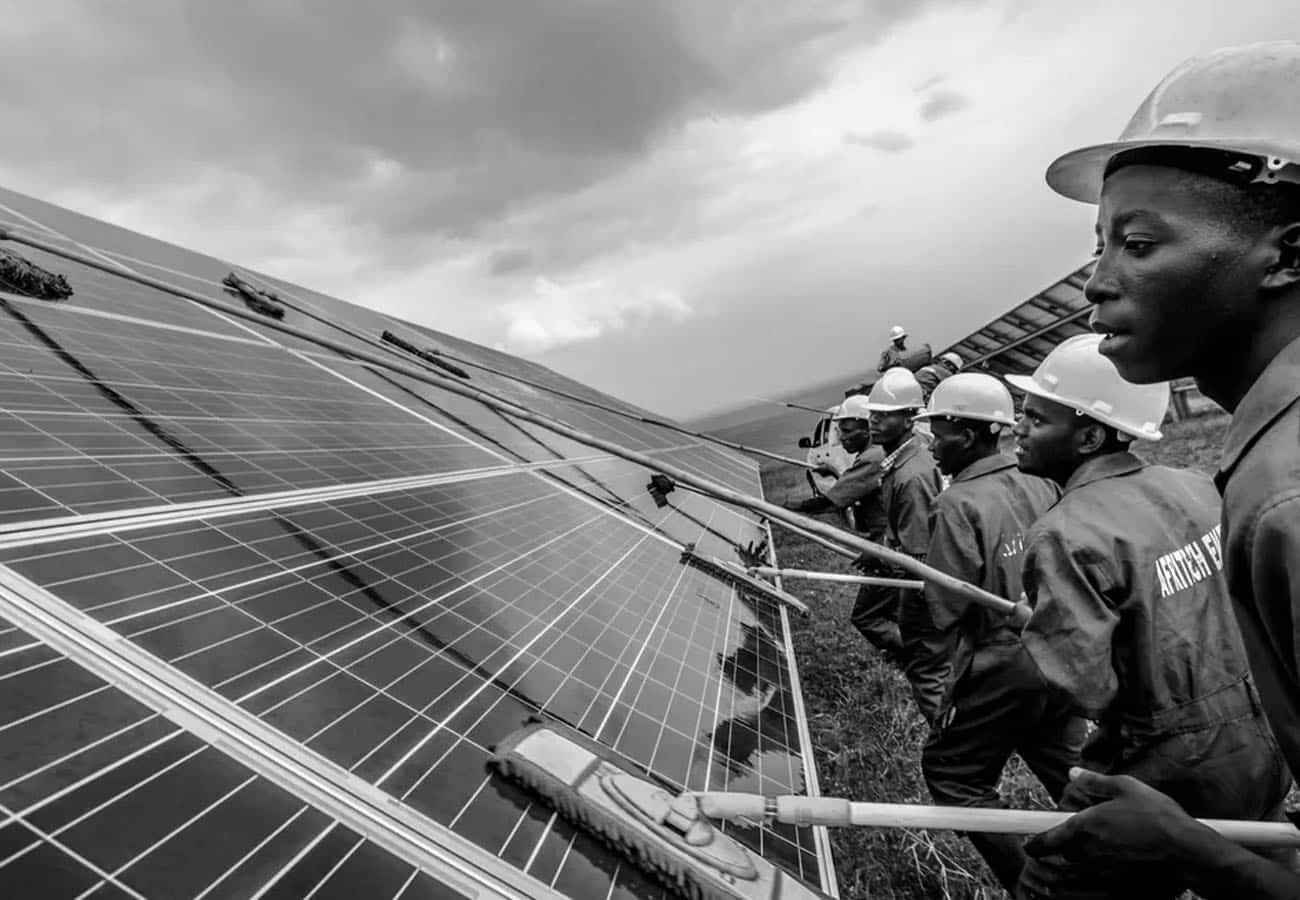 Male Workers Maintaining a Solar Panel