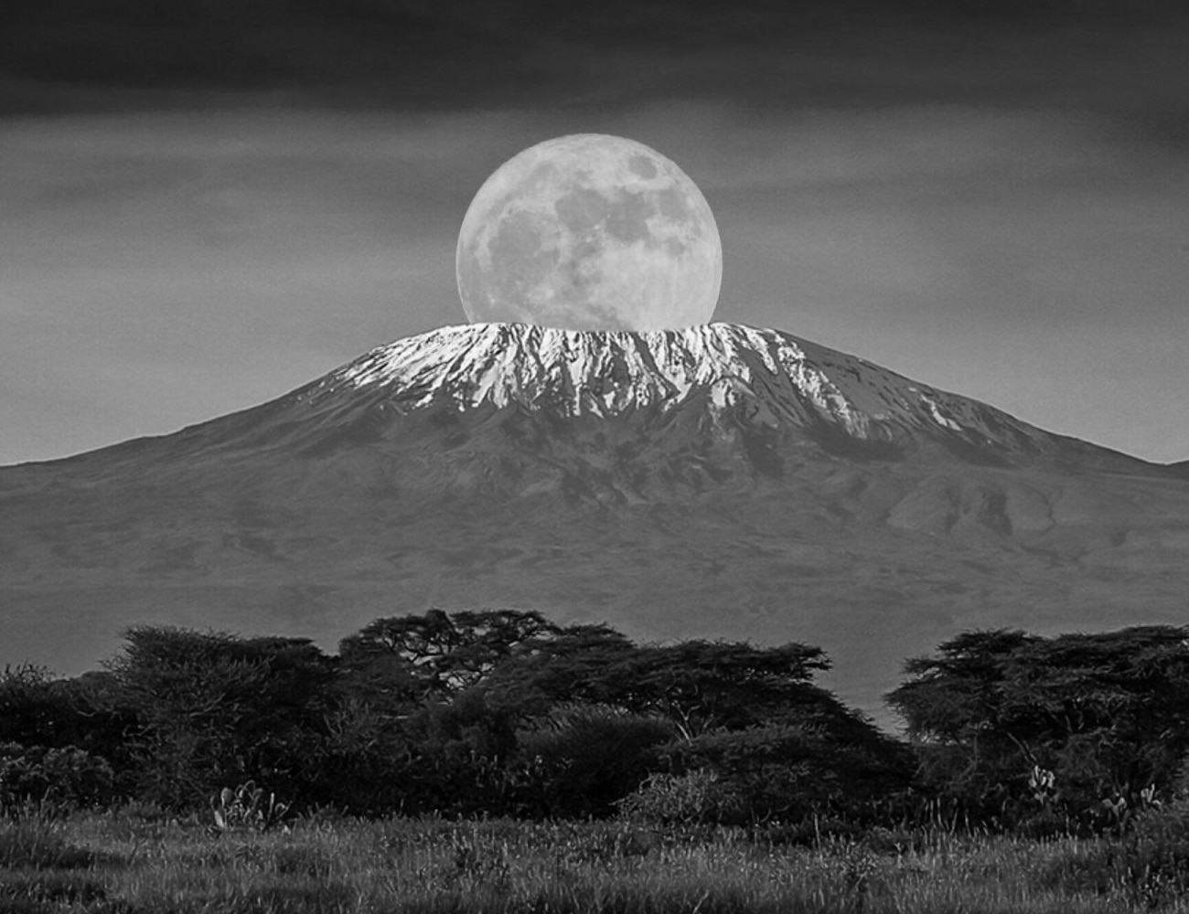 The Moon Setting Over Mount Kilimanjaro's Peak
