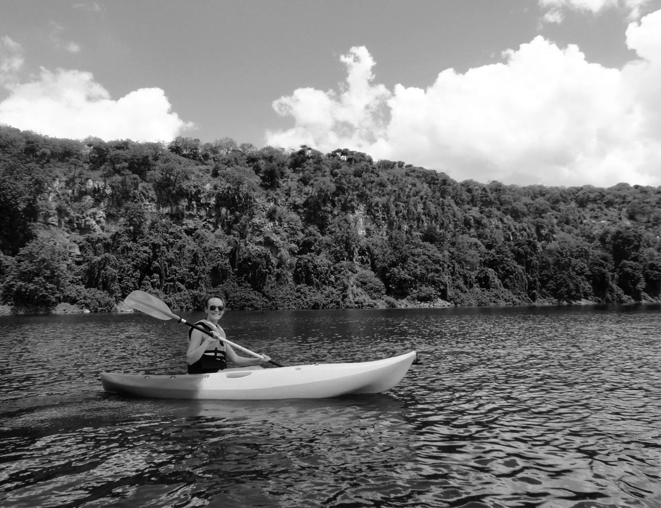 A Woman Canoeing at Lake Duluti