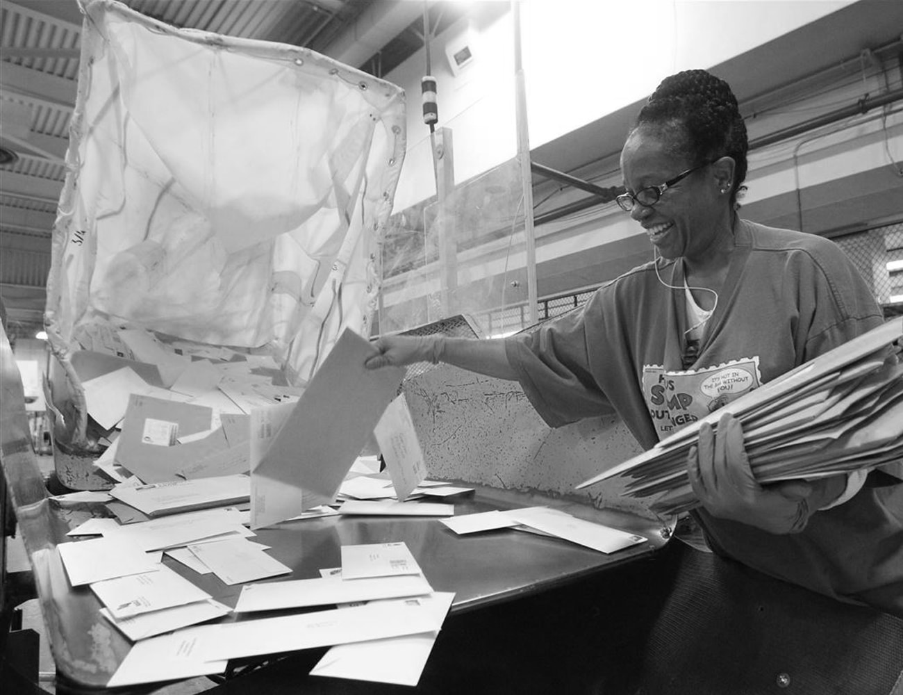 A Woman Sorting Mail at a Post Office