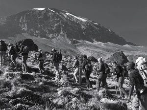 Travelers climbing Mount Kilimanjaro