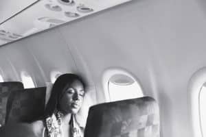A woman sleeping during a long flight