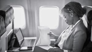 A woman working during the flight
