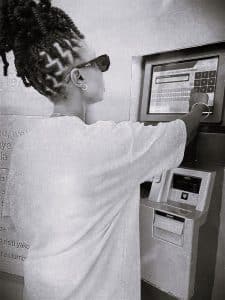 A customer converting currency through ATMs
